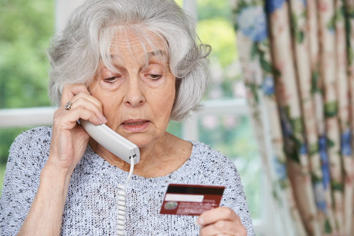 ELDERLY WOMAN PAYING FOR LONG TERM CARE OVER THE PHONE WITH CREDIT CARD