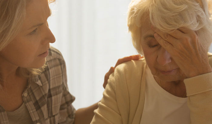 caregiver concerned with elderly mother memory
