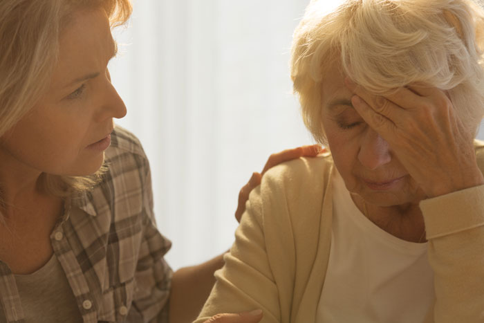 caregiver daughter concerned for elderly mother